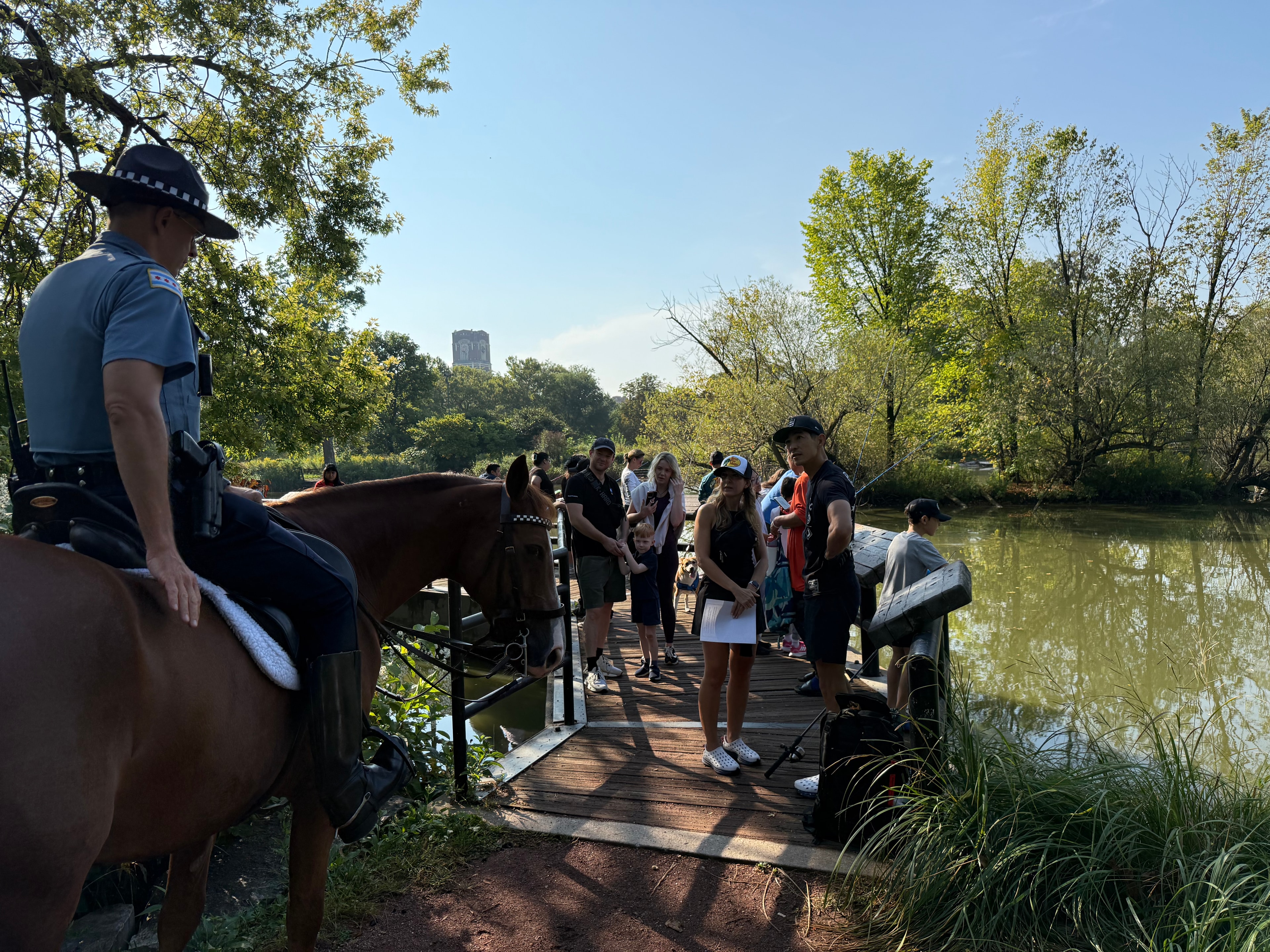 CPD mounted officer on horseback at the McKinley Park bridge during the fishing derby